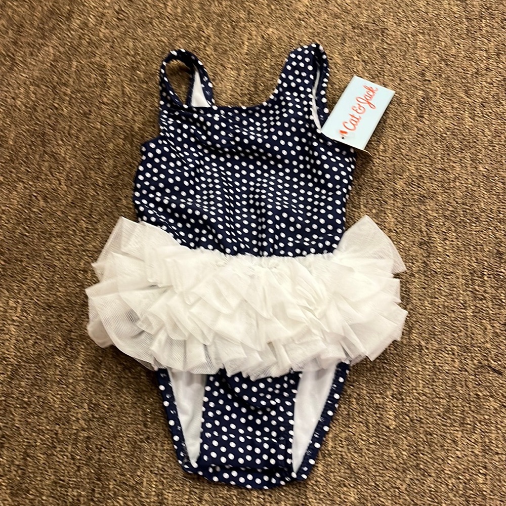 This is too cute ! This ruffle navy polka dot bathing suit is adorable